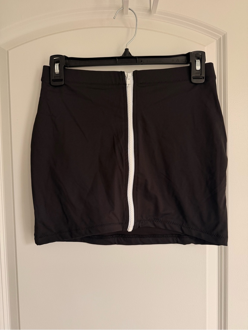 SKIMS Black Mini Skirt with White Center Zipper Trim